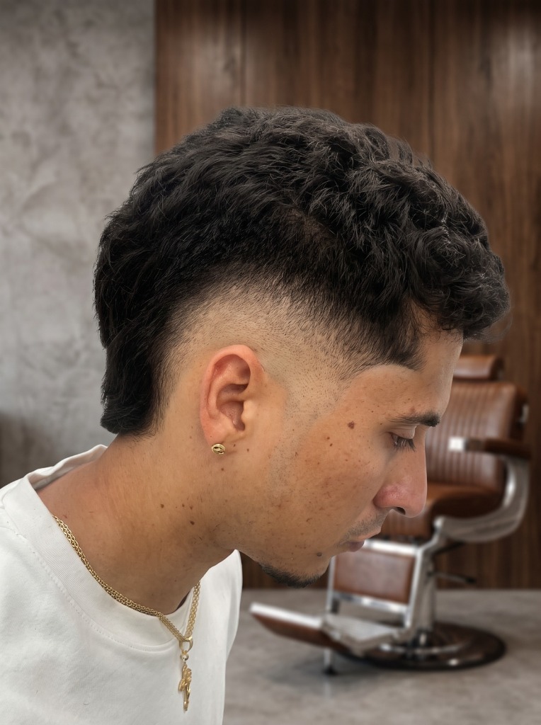 Curly skin fade — fresh from the chair at Tom's Barber